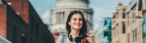 Young college-aged woman walking streets abroad.