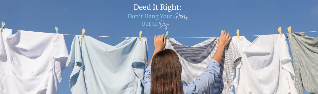 A woman hanging laundry on a clothesline in the sunshine.